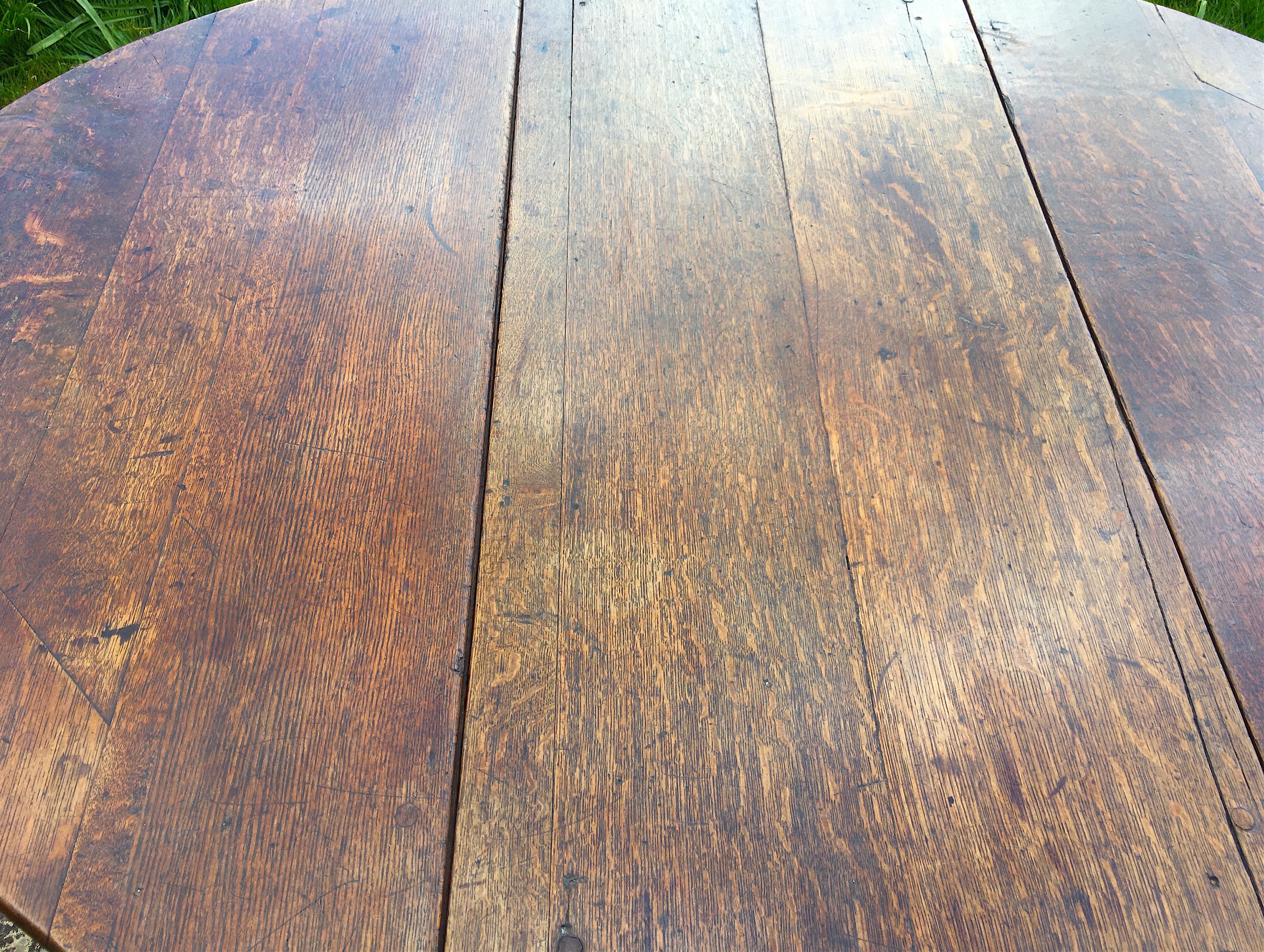 An 18th century oak gateleg dining table, the turned underframe with traces of old paint, length 123cm, depth extended 134cm, height 72cm *Please note the sale commences at 9am.